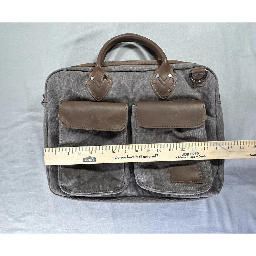 Renwick canvas briefcase featuring genuine leather trim missing shoulder strap
